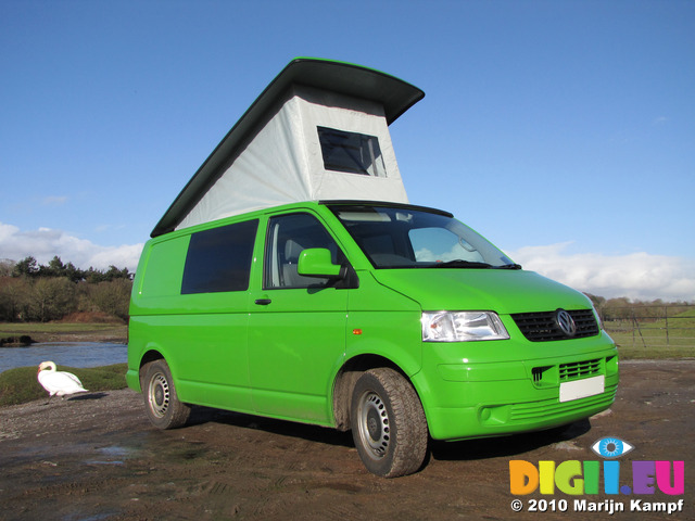 SX12376 Our green VW T5 campervan with popup roof up at Ogmore Castle